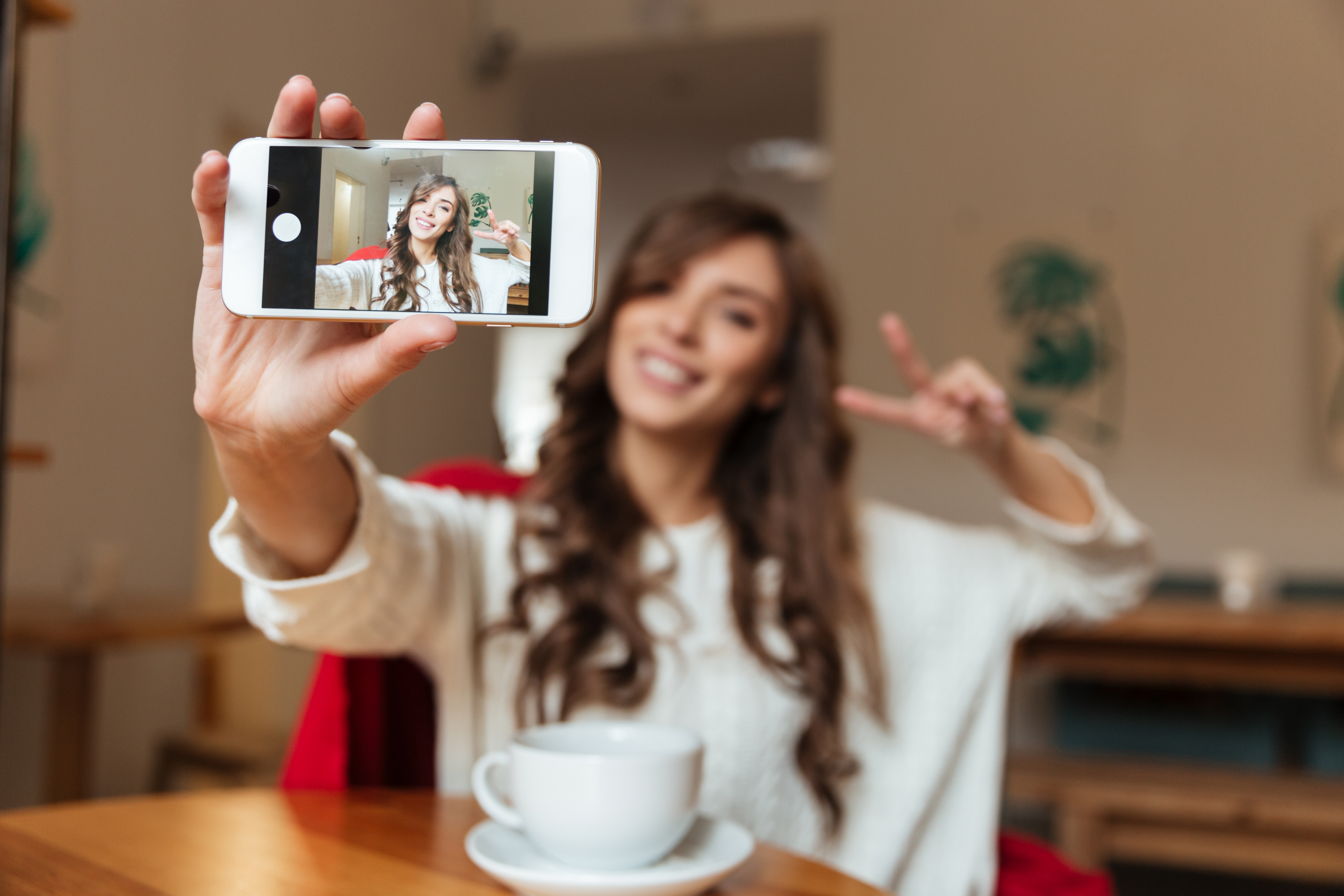 portrait of cheerful woman taking selfie portrait of cheerful woman taking selfie