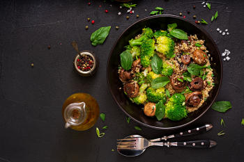 dietary menu healthy vegan salad vegetables broccoli mushrooms spinach quinoa bowl flat lay top view