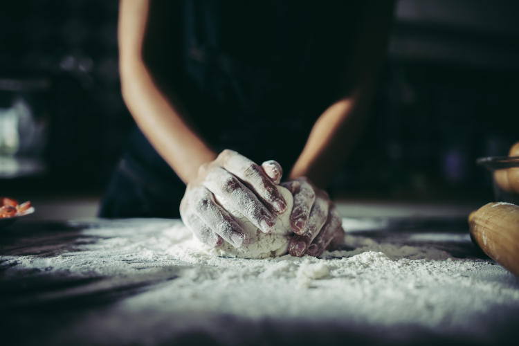 woman-kneads-dough-for-make-pizza-on-wooden-cooking-concept woman-kneads-dough-for-make-pizza-on-wooden-cooking-concept