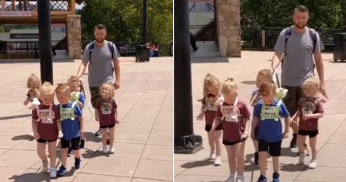 Padre que pasea a sus hijos con correa Padre que pasea a sus hijos con correa