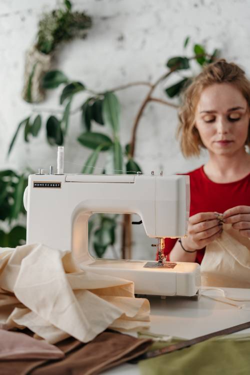 woman in red shirt sewing 3738103